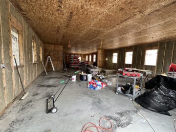Interior of the new Gardenmats shop under construction after the January 2023 fire burned it all down